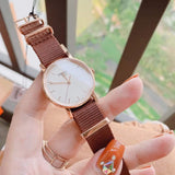  Shop Authentic Tissot Everytime Desire White Dial Maroon NATO Strap Watch for Women - T109.210.37.031.00 - Luxxuri