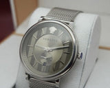  Shop Authentic Versace V-Circle Silver Dial Silver Mesh Bracelet Watch for Men - VBQ060017 - Luxxuri