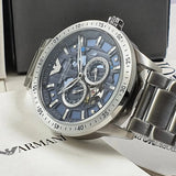  Shop Authentic Emporio Armani Mario Chronograph Automatic Blue Dial Silver Steel Strap Watch For Men - AR60052 - Luxxuri