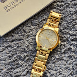  Shop Authentic Burberry The City Gold Dial Gold Steel Strap Watch for Men - BU9038 - Luxxuri