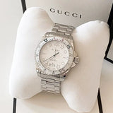 Shop Authentic Gucci Dive Quartz White Dial Silver Steel Strap Watch For Men - YA136336 - Luxxuri
