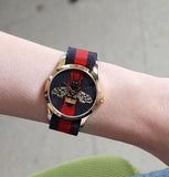  Shop Authentic Gucci G Timeless Bee Red & Blue Dial Red Two Tone Nylon Strap Watch For Men - YA1264061 - Luxxuri